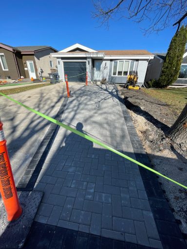 Barkman Holland paver driveway in progress completed by Genesis Interlocking & Custom Landscaping in Winnipeg