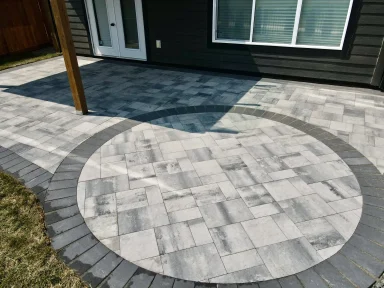 Belgard Dimensions 12 paver patio with charcoal border completed by Genesis Interlocking & Custom Landscaping in Winnipeg
