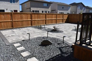 Barkman Broadway paver patio in sterling with charcoal border completed by Genesis Interlocking & Custom Landscaping in Winnipeg