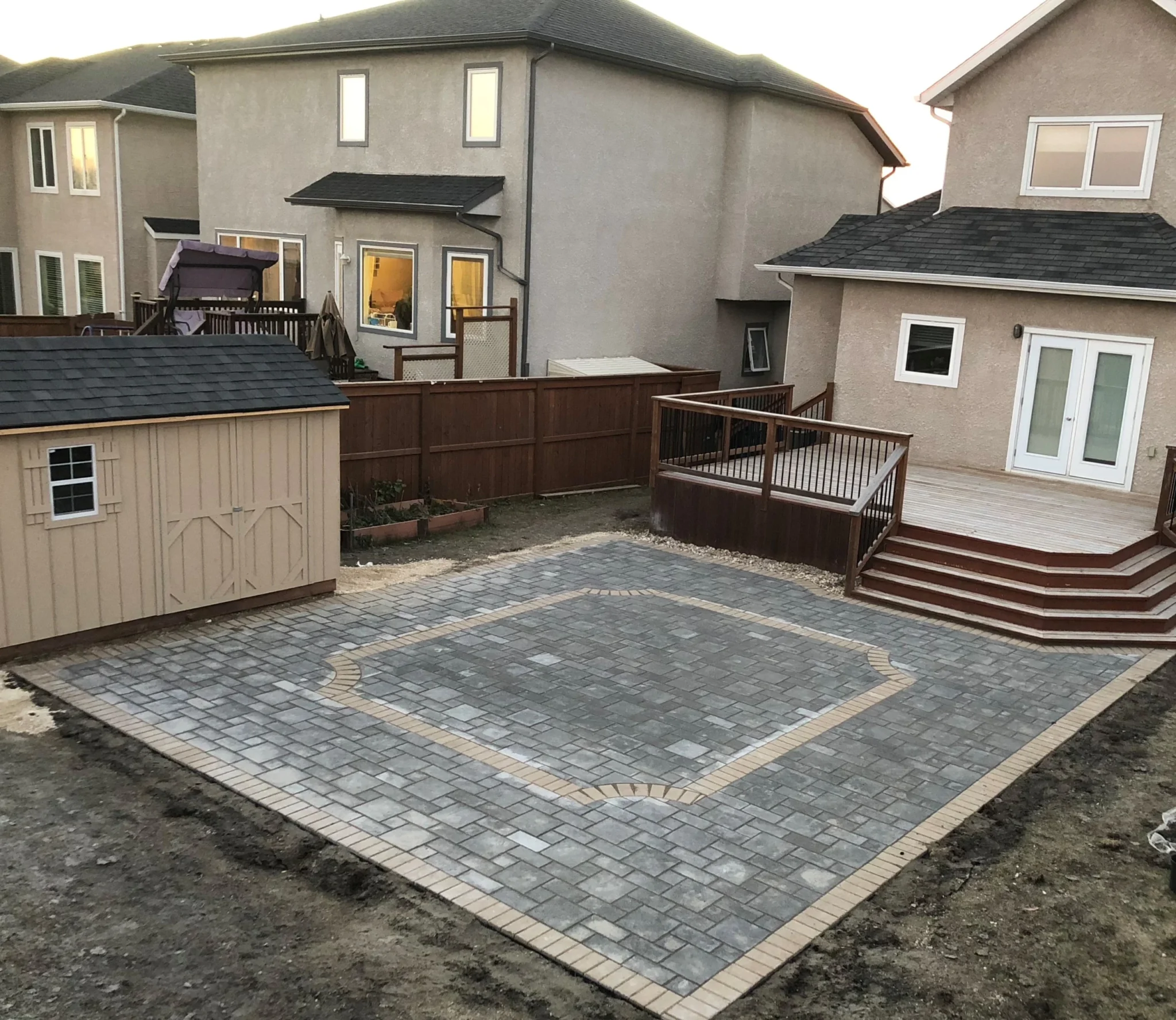 Barkman verano paver patio installation with custom inlay - Winnipeg landscaping