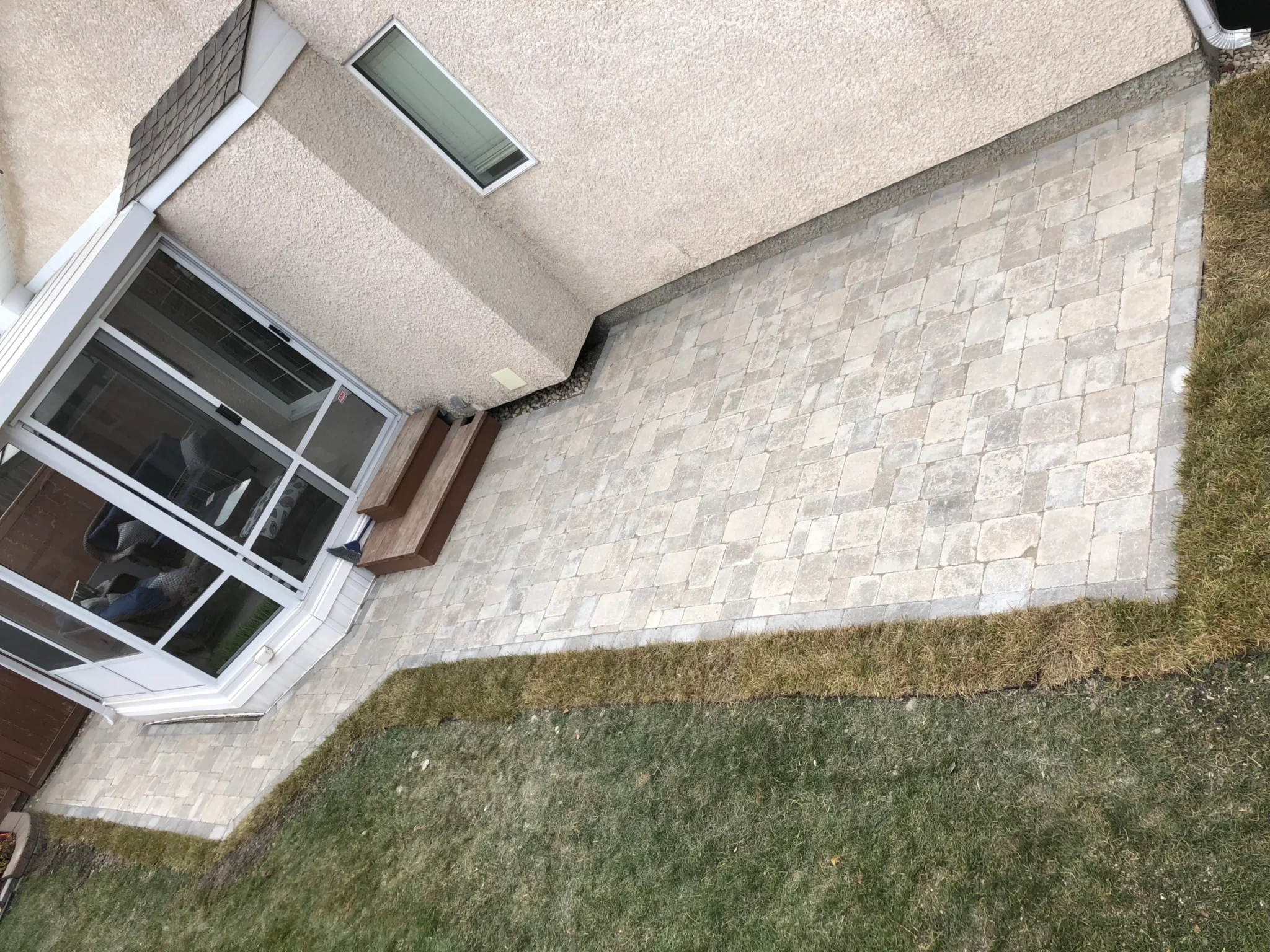 Roman paver patio installation - Winnipeg landscaping