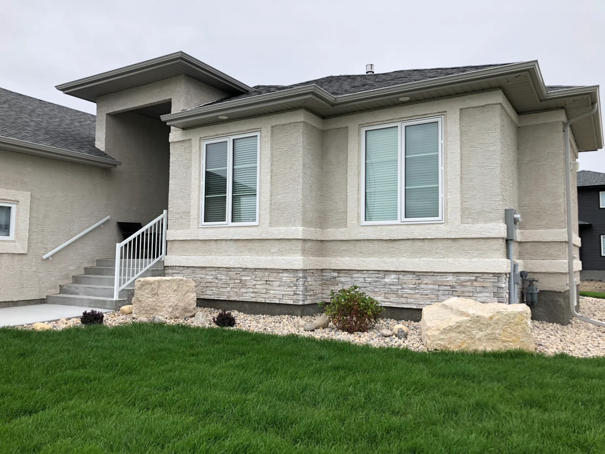 Winnipeg front yard landscaping decorative rocks, boulders, plants and sod