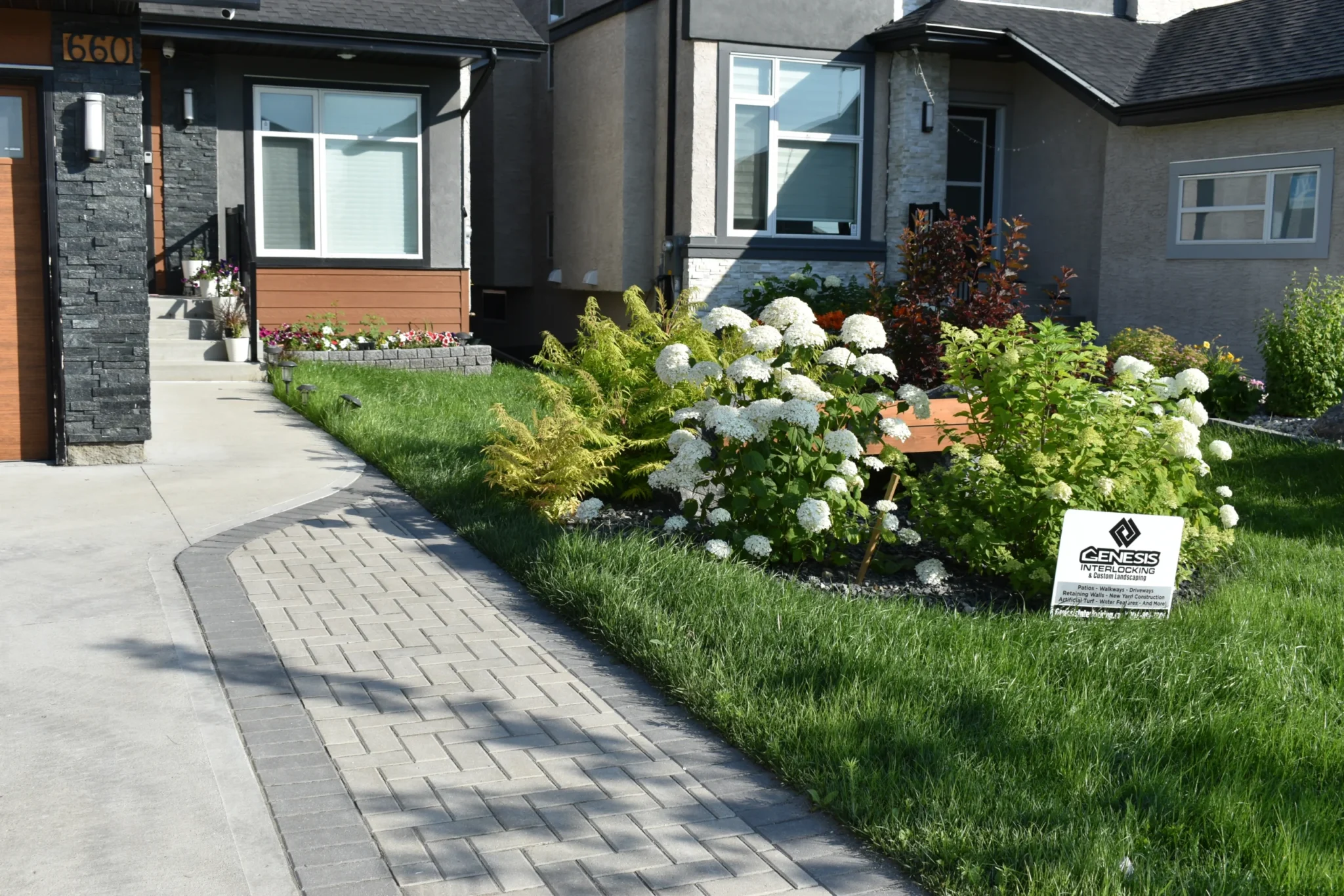 Front driveway Holland paver installation - Winnipeg Landscaping