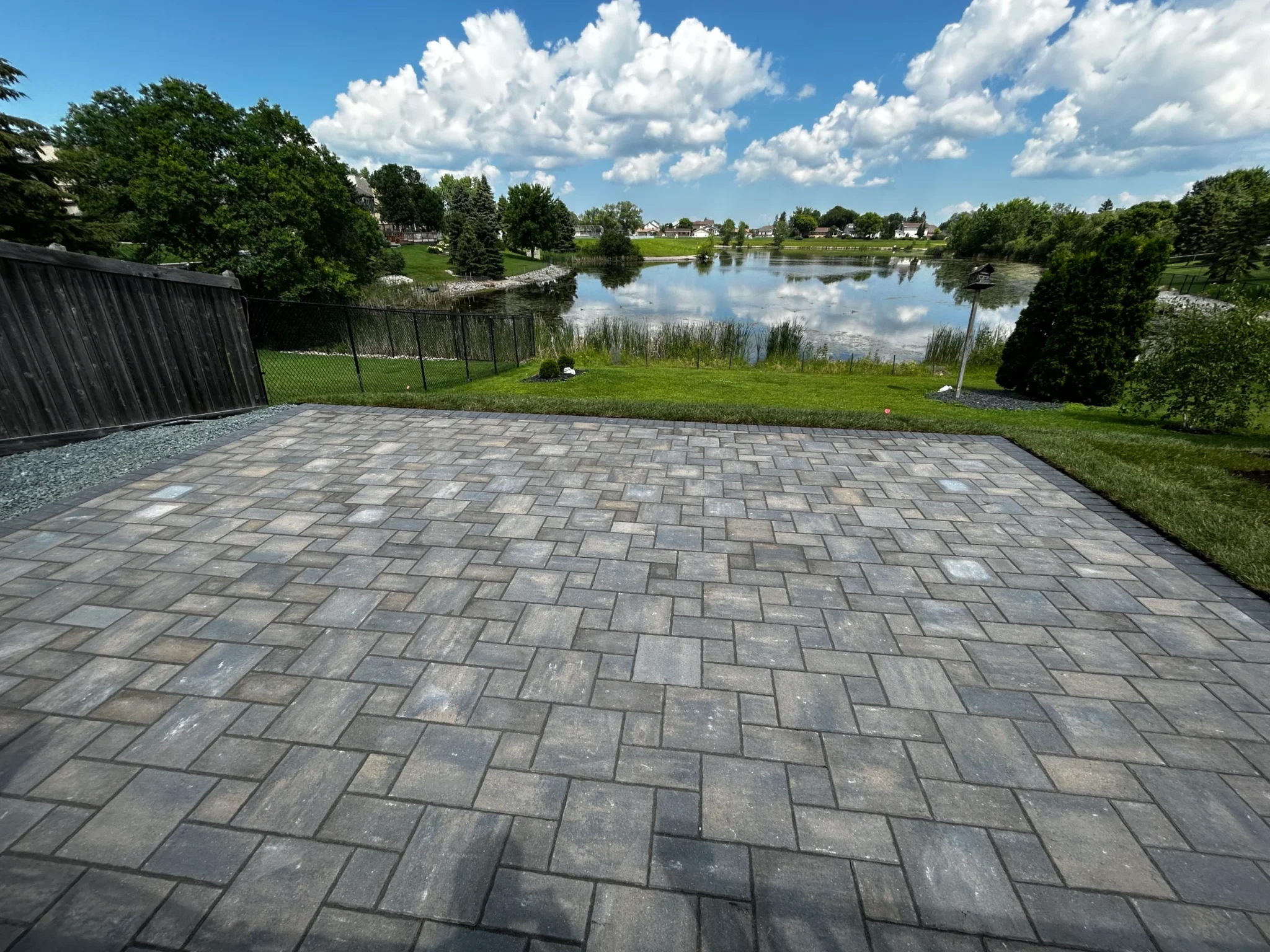Barkman Verano paver installation with waterfront view - Landscaping Gallery Winnipeg