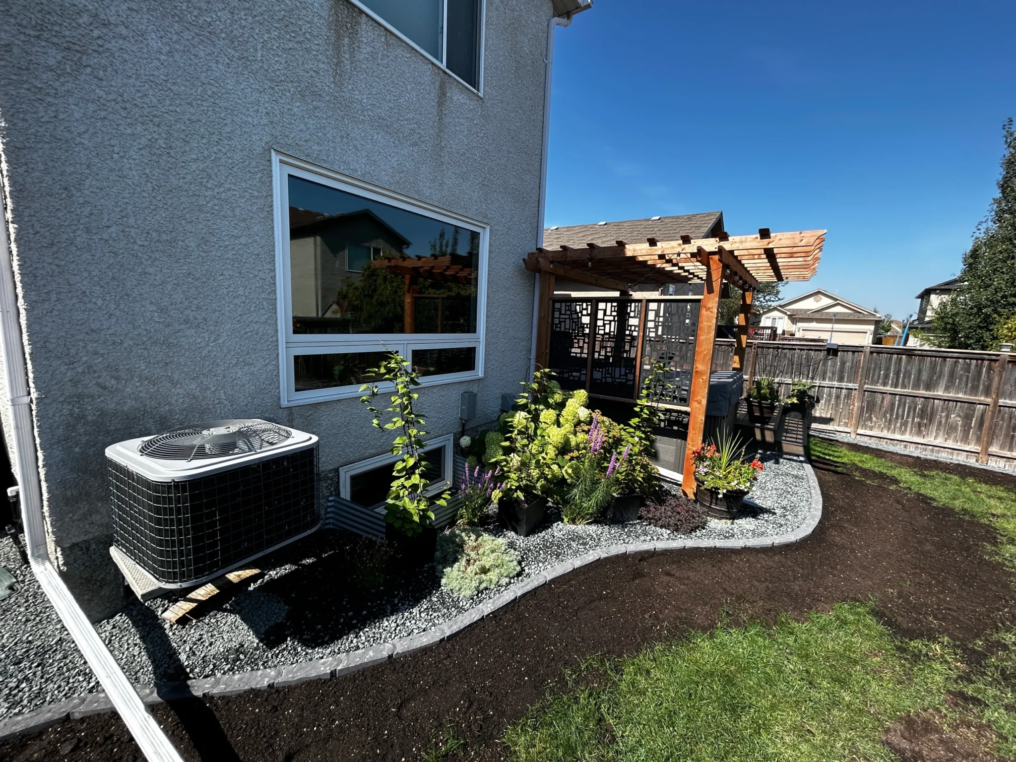 Icon edging, plants & decorative rock installation 