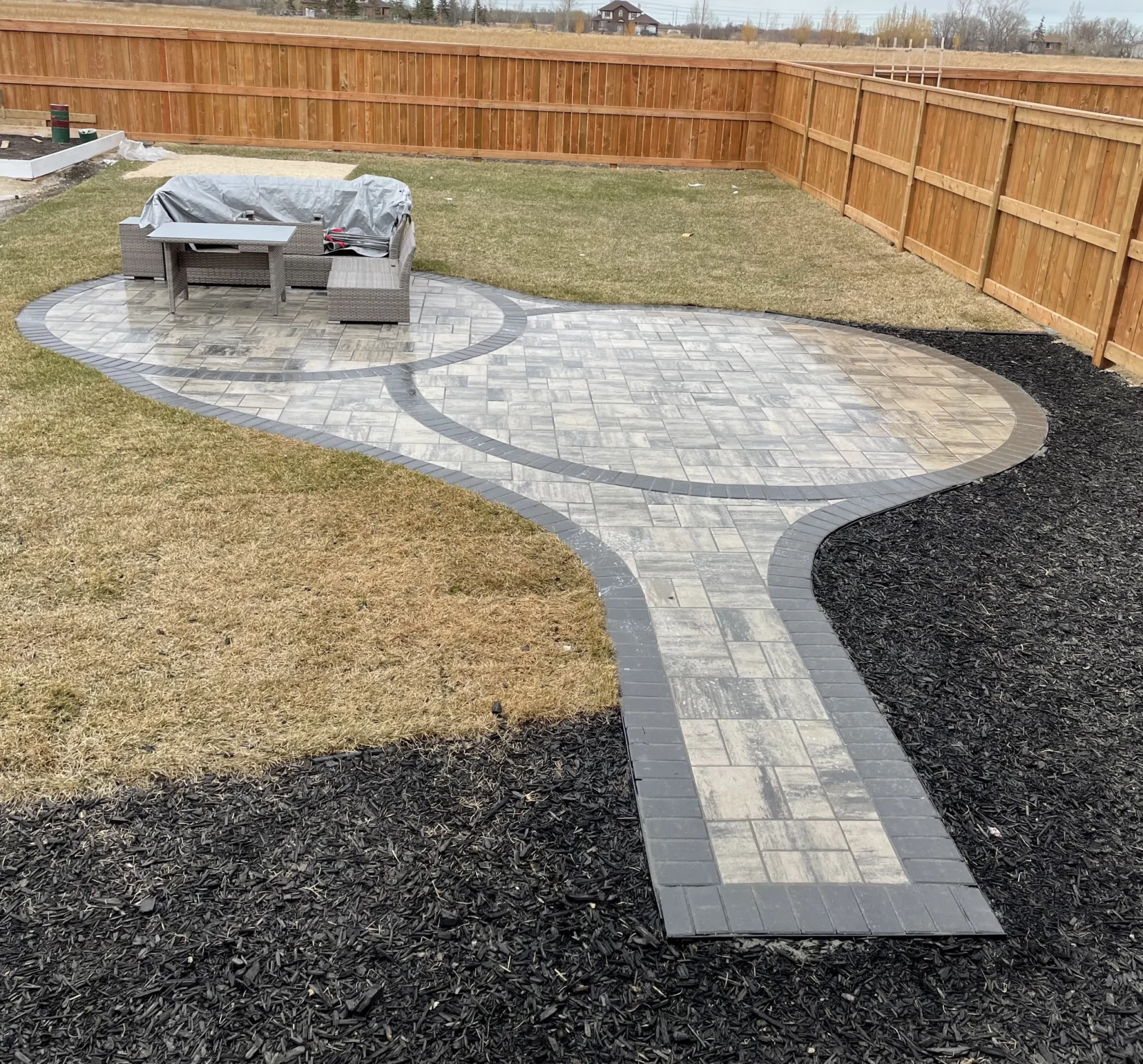 Custom multi space patio - Barkman Broadway slabs - Interlocking Patios Winnipeg