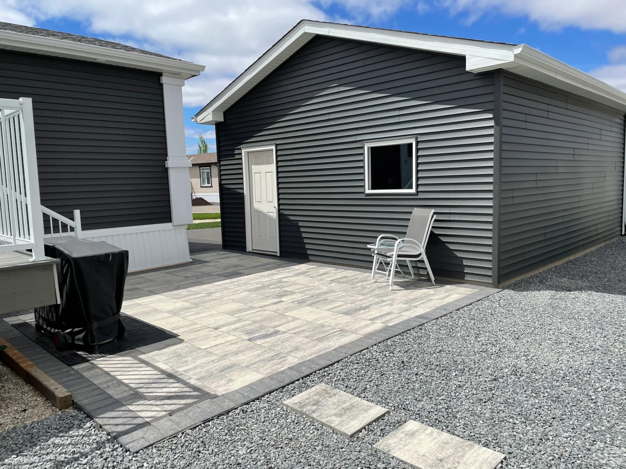 Side yard patio space - Barkman Broadway paver installation - Interlocking Patios Winnipeg
