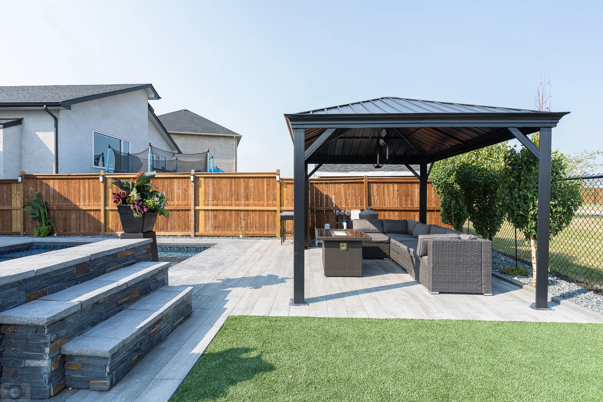 Genesis Interlocking & Custom Landscaping backyard pool project - Paving stone patio / pool deck, artificial turf, gazebo - Landscaping Gallery Winnipeg