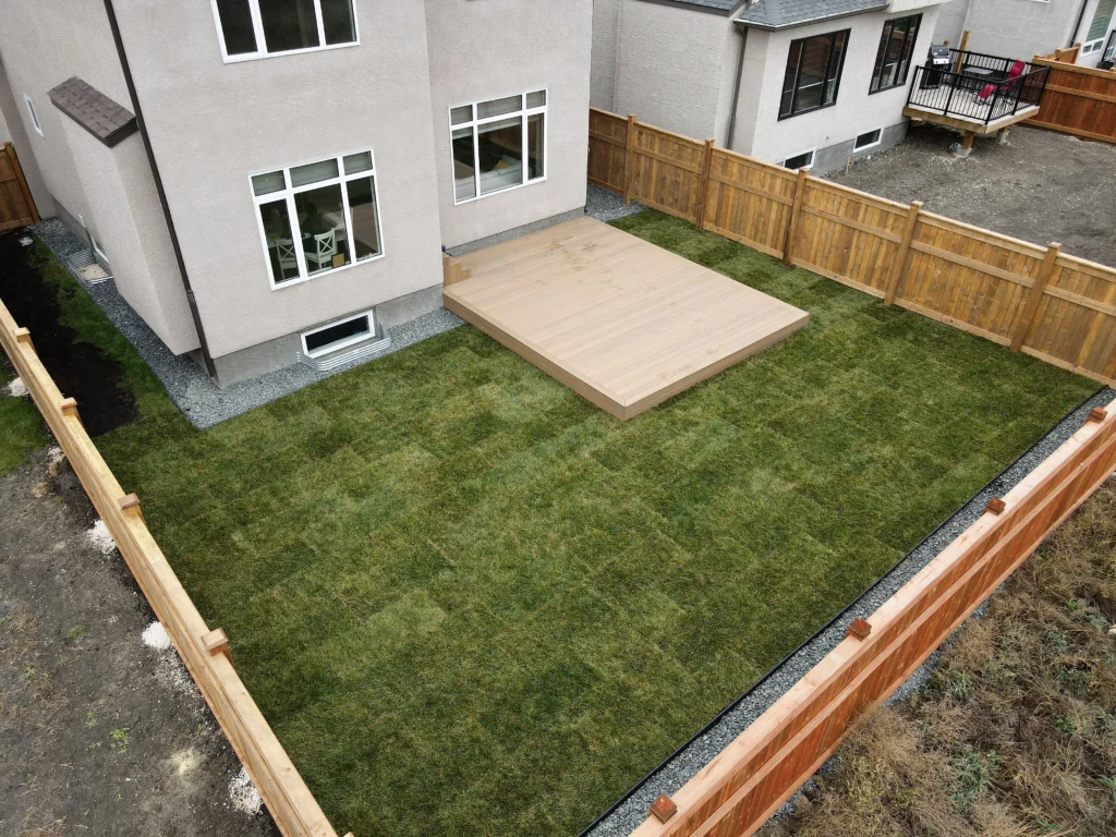 Composite Decking & Pressure Treated Fence with fresh kentucky blue sod Installation - Winnipeg Manitoba Landscaping
