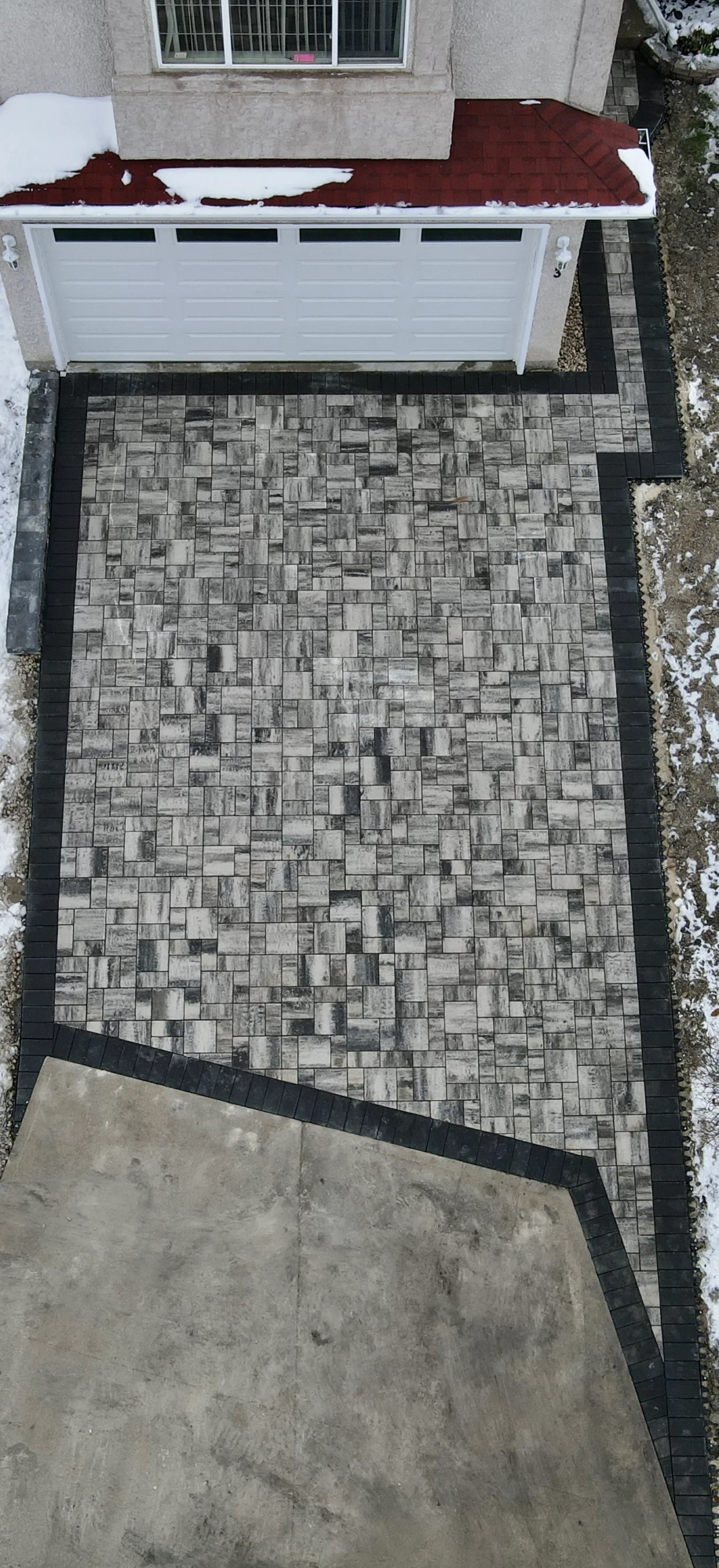 Barkman Broadway slab driveway installation - Completed in Winnipeg Manitoba by Genesis Interlocking & Custom Landscaping - Driveways and Sidewalks Winnipeg 