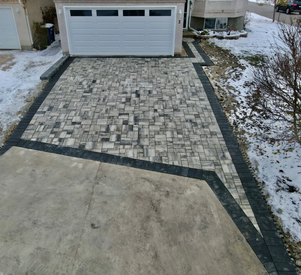 Barkman Broadway slab driveway installation - Completed in Winnipeg Manitoba by Genesis Interlocking & Custom Landscaping