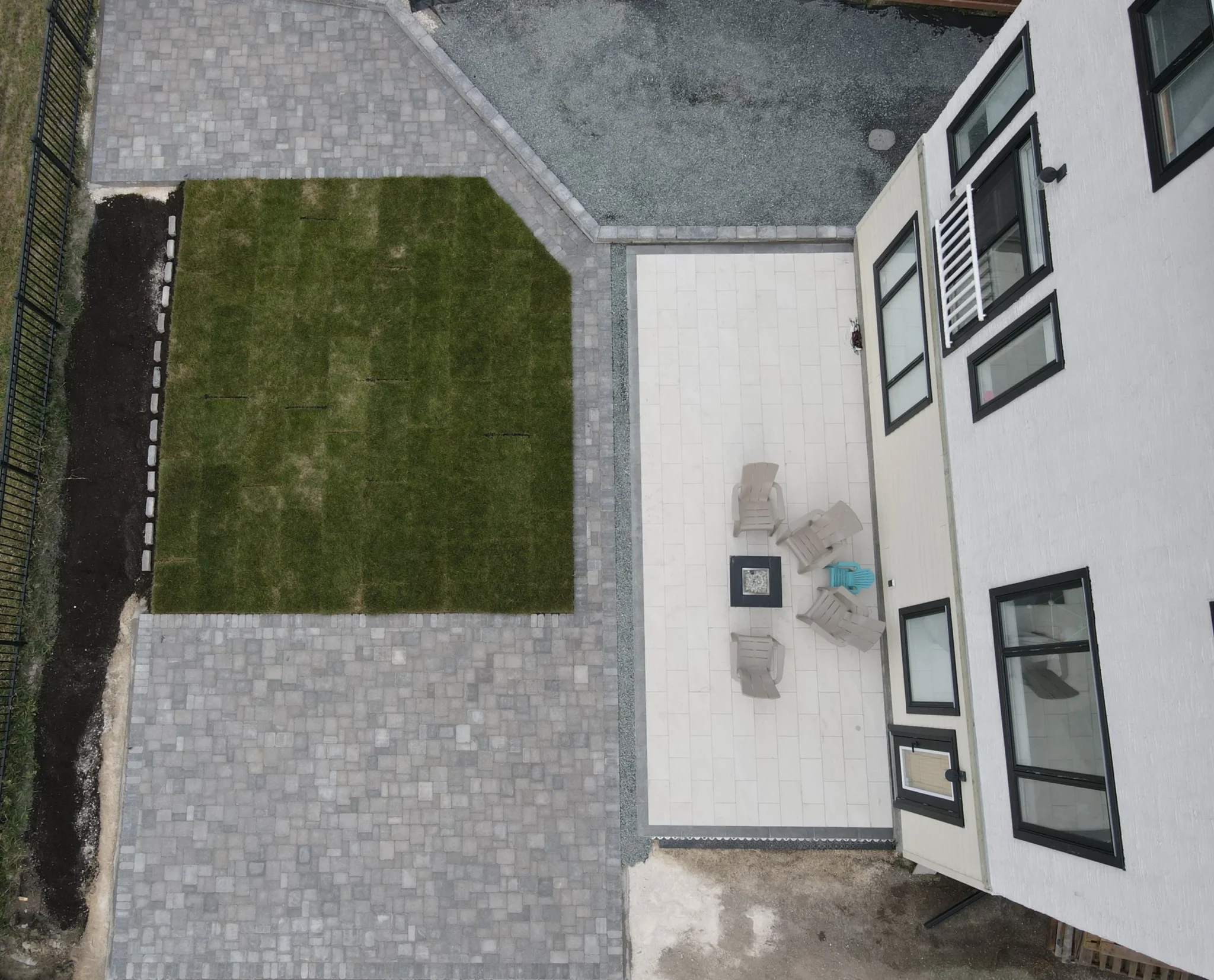 Backyard interlocking patio install - Barkman roman pavers, quarry stone wall, sod & black granite