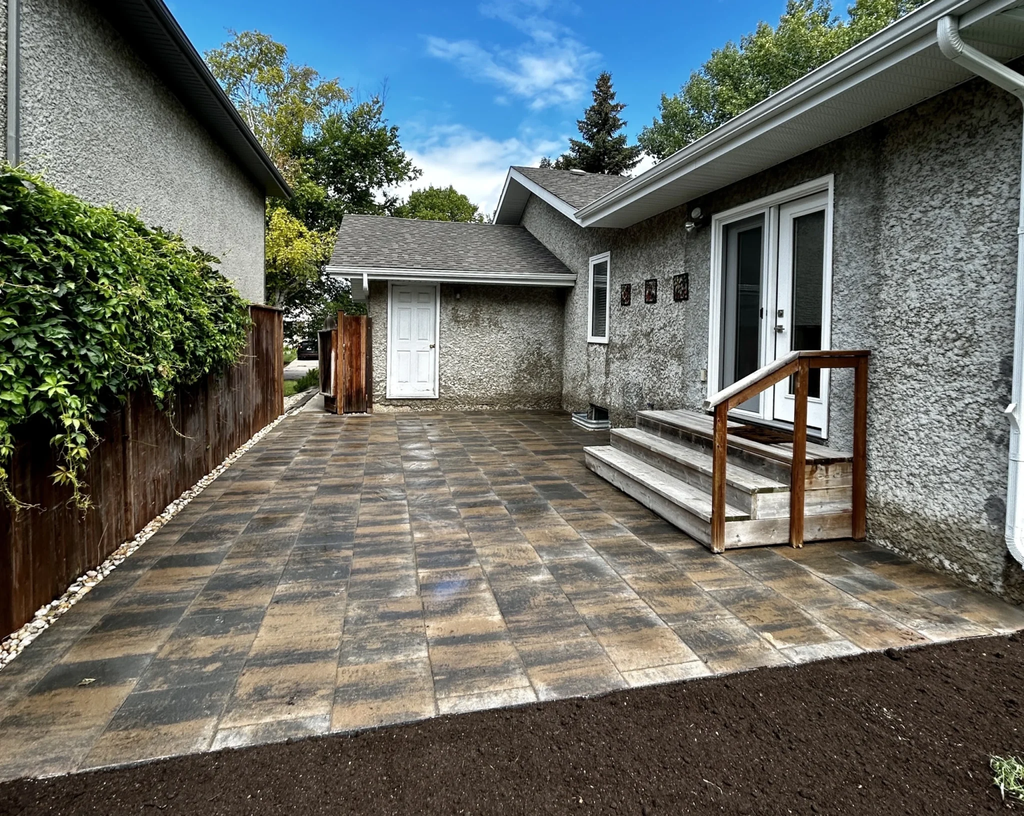 Barkman Brookside slab patio installation - Winnipeg Landscaping