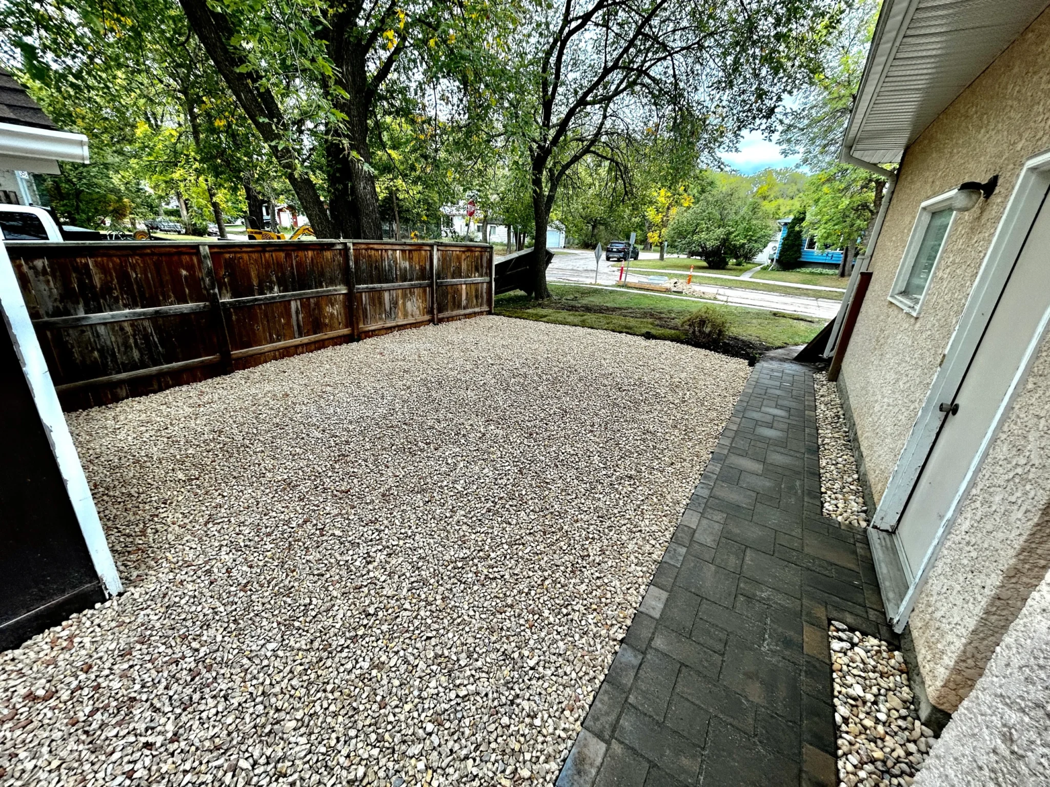 Barkman Verano Paver sidewalk installation - side yard landscaping with decorative rock - Landscaping Gallery Winnipeg