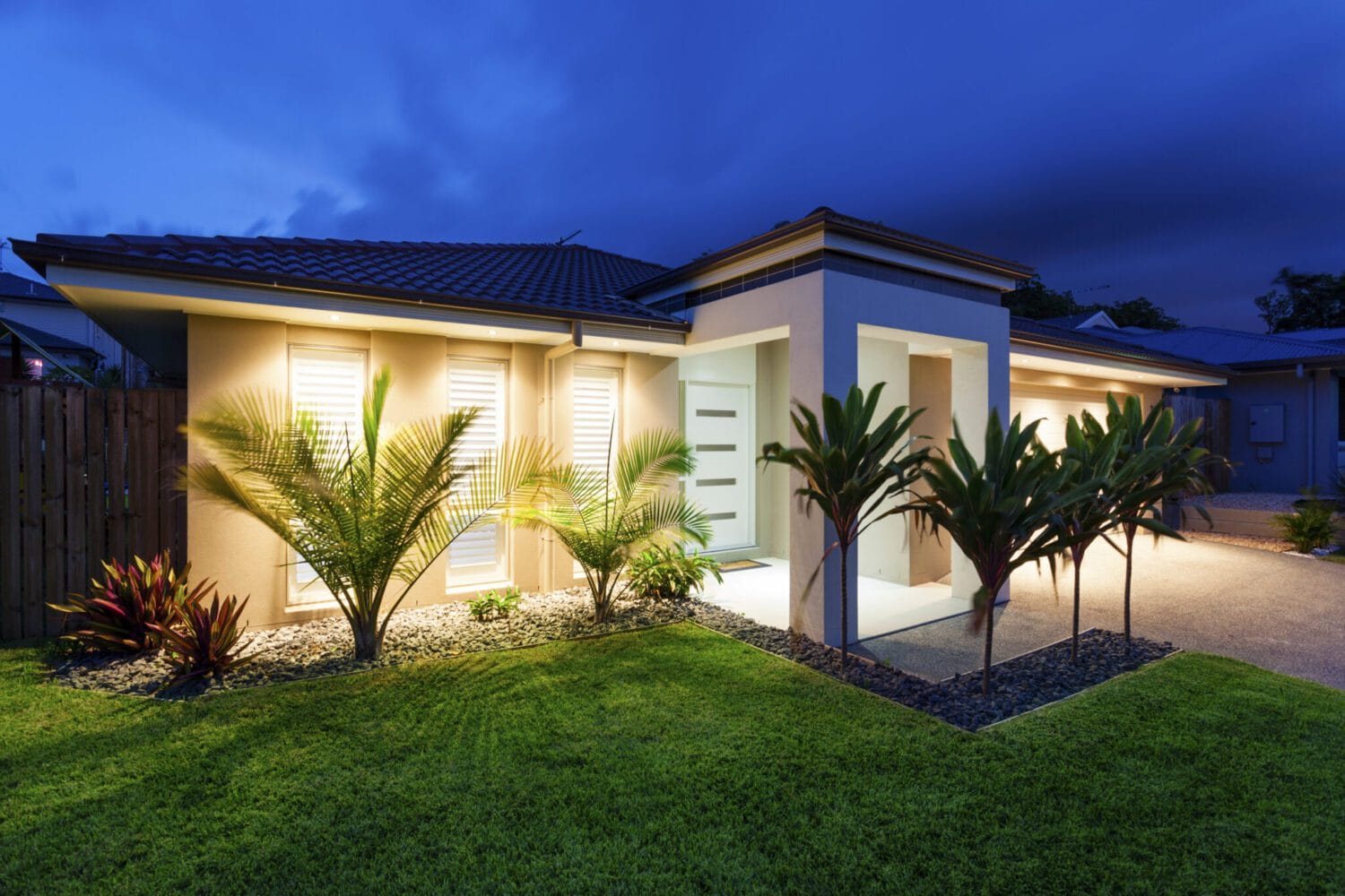Front yard landscaping with low voltage lighting, trees and plants & sod