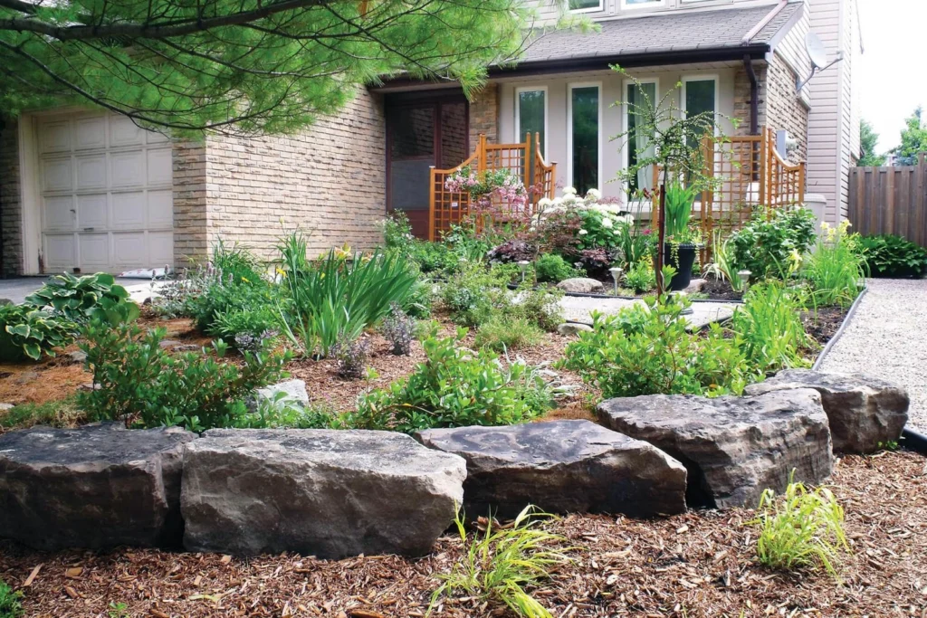 Front yard boulder retaining wall installation 