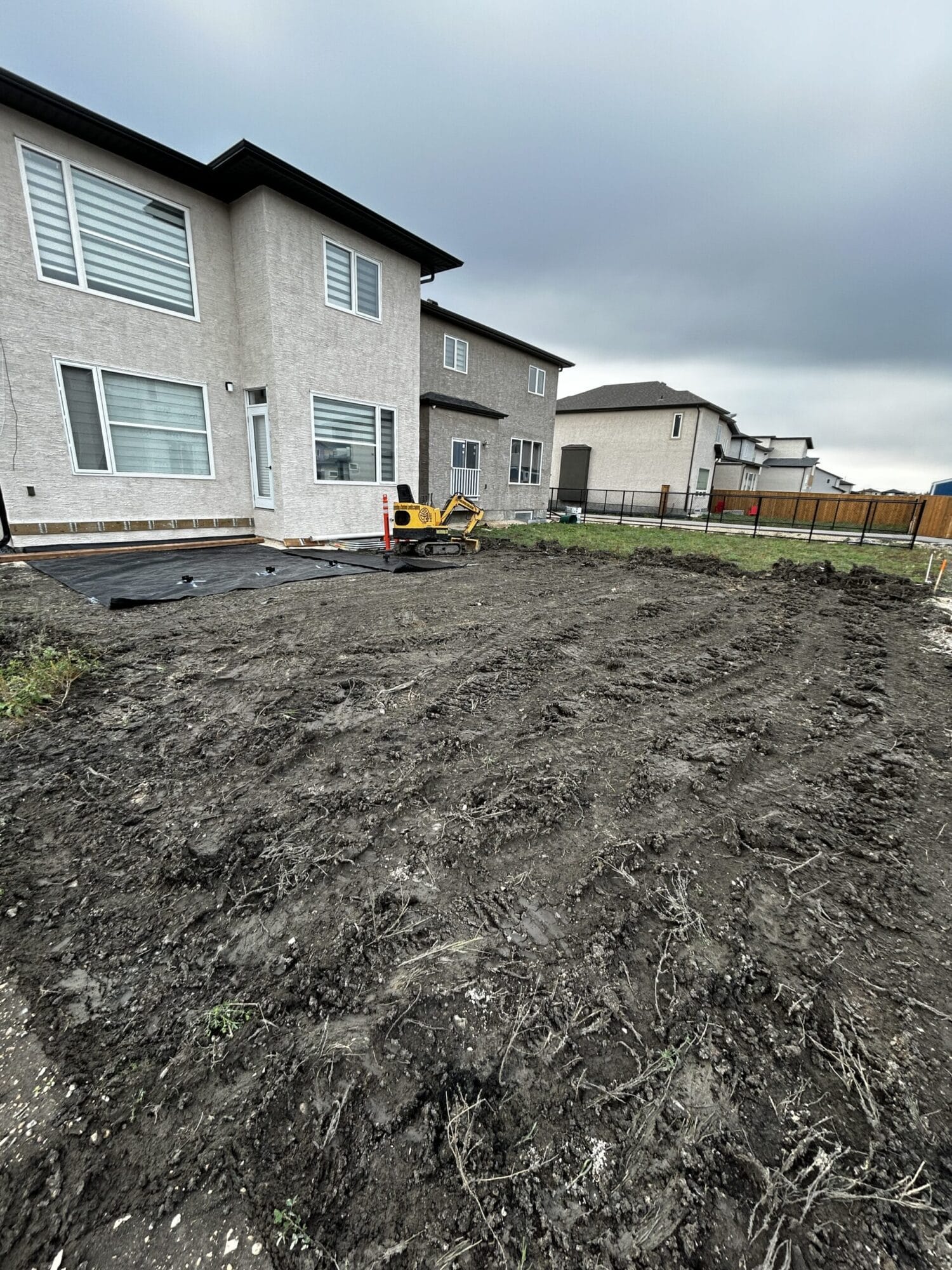 Yard grading & levelling in Winnipeg Manitoba by Genesis Interlocking & Custom Landscaping