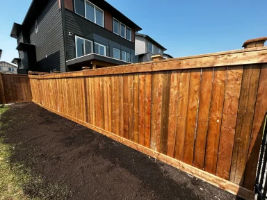Pressure treated 6x6 fence completed by Genesis Interlocking & Custom Landscaping