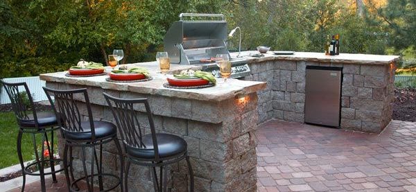 Outdoor kitchen and grill with bar stools