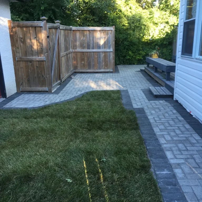 Barkman Holland paver patio in natural grey with charcoal border completed by Genesis Interlocking & Custom Landscaping - Winnipeg Landscaping 