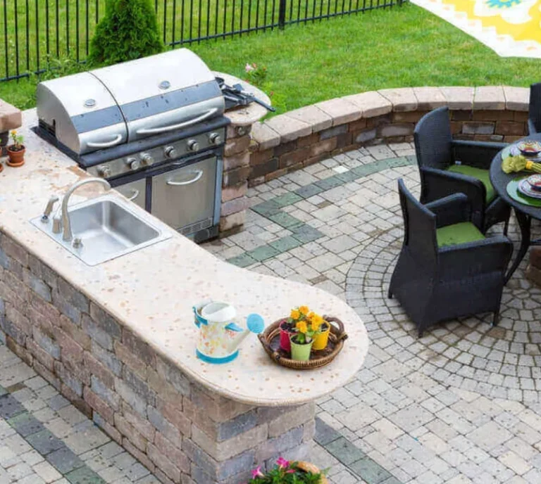 Outdoor kitchen BBQ sink with circle patio seating area