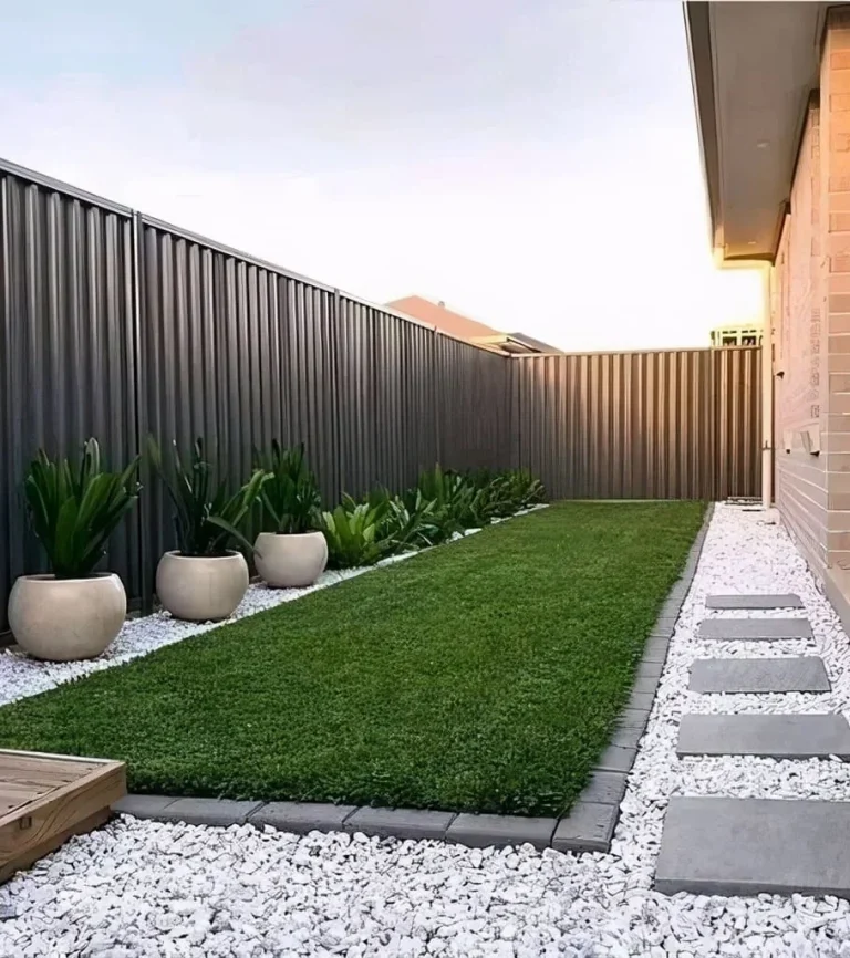 Low maintenance backyard, decorative rock, stepping stones, and artificial turf