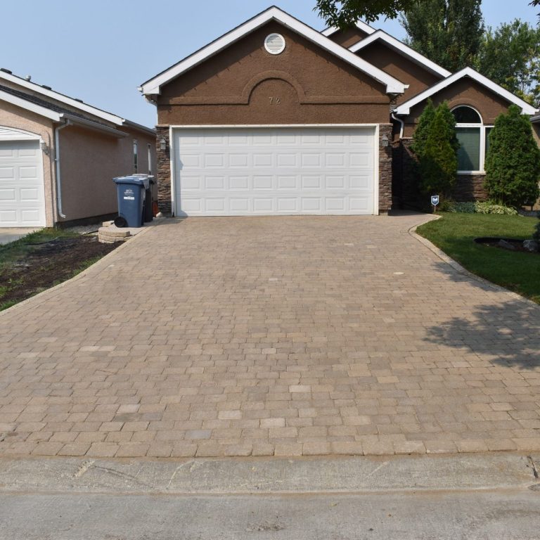 Barkman Roman paver driveway completed by Genesis Interlocking & Custom Landscaping - Winnipeg Landscaping 