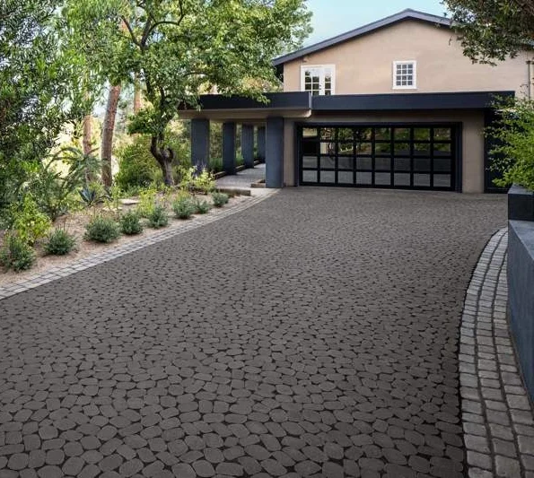 Interlocking stone front driveway and modern home