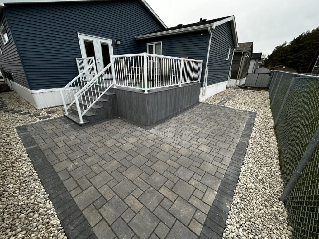Barkman verano paver patio and composite deck installation by Genesis Interlocking & Custom Landscaping