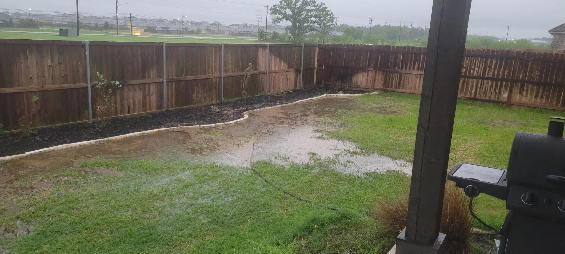 water pooling in backyard from incorrect grading 